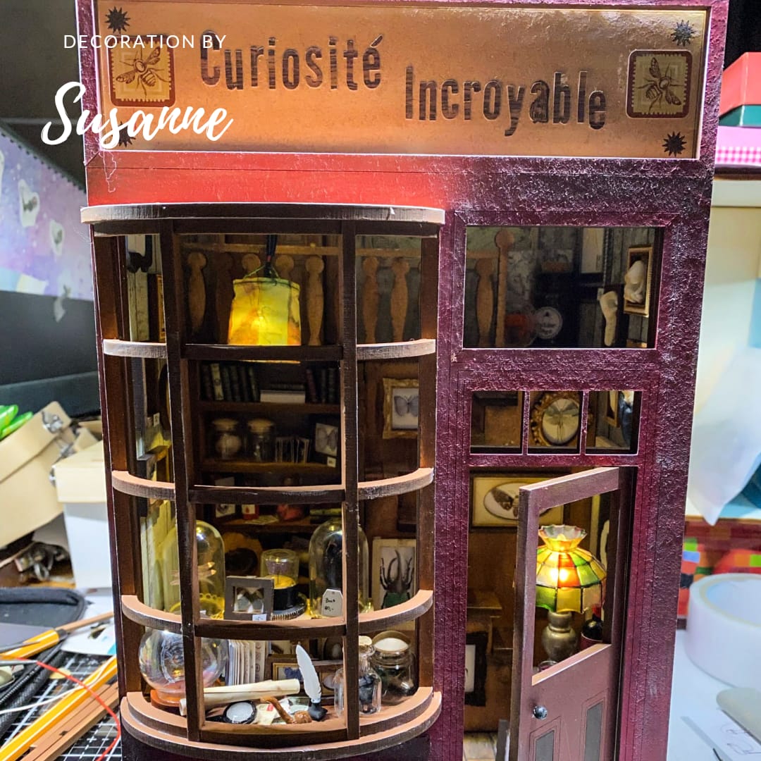 a store front with a clock on the wall