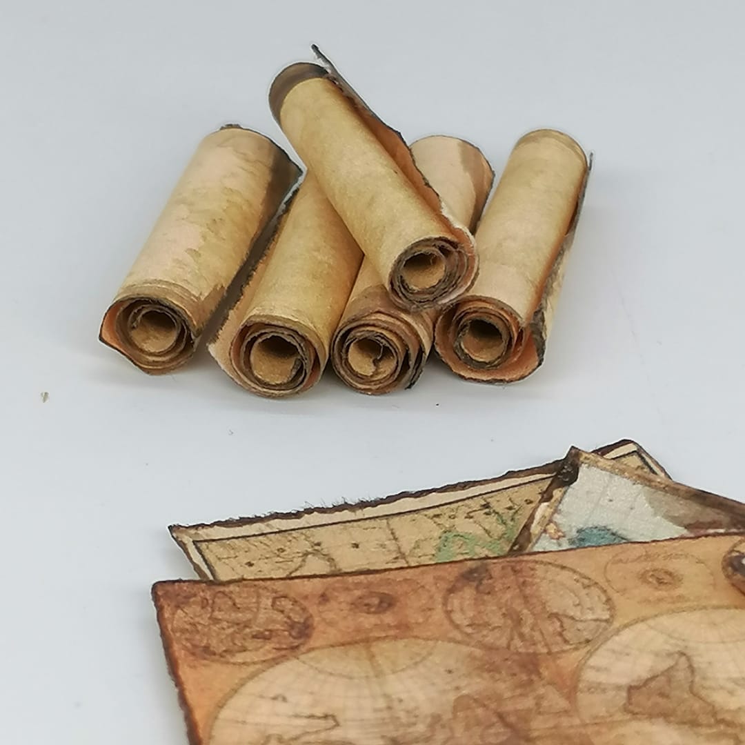 Miniature world maps and scrolls