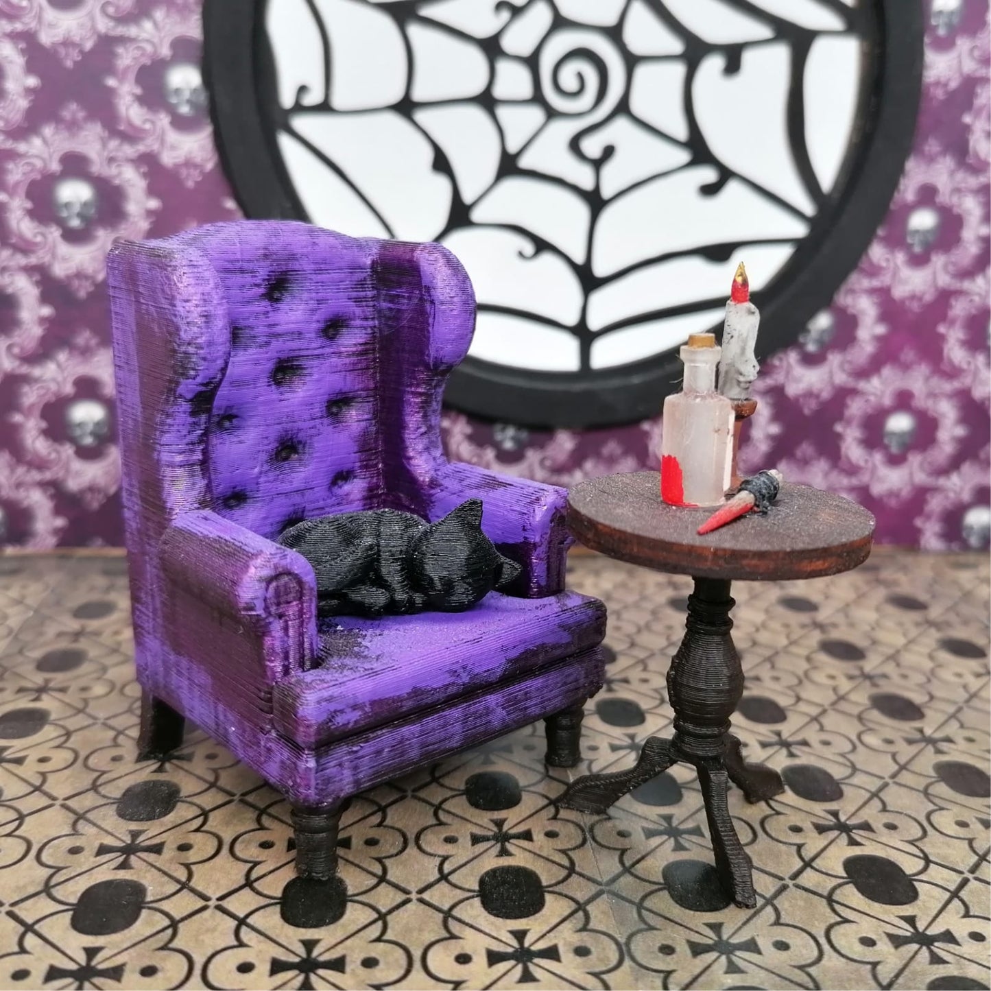 a purple teddy bear sitting on a chair 