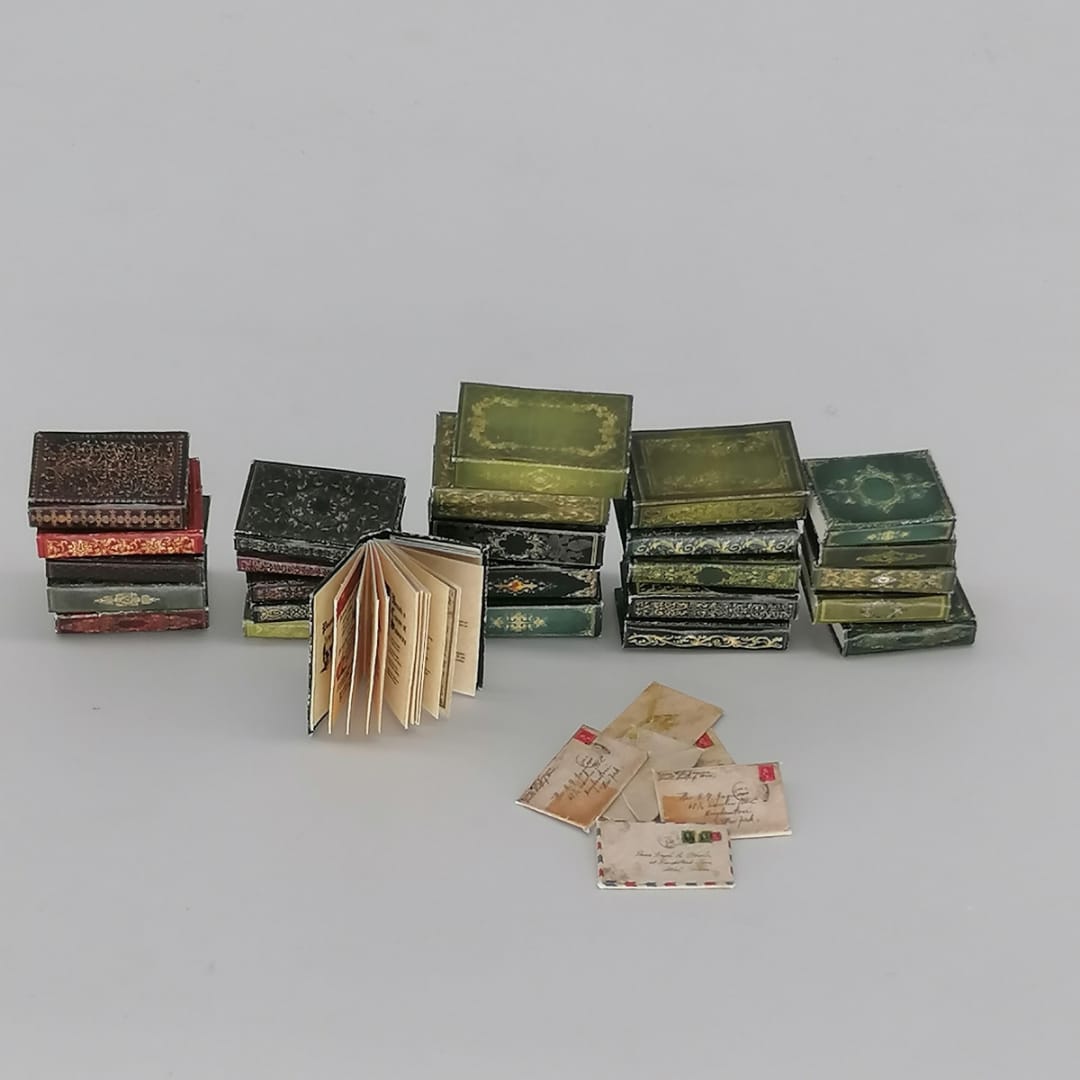 Different sized miniature books