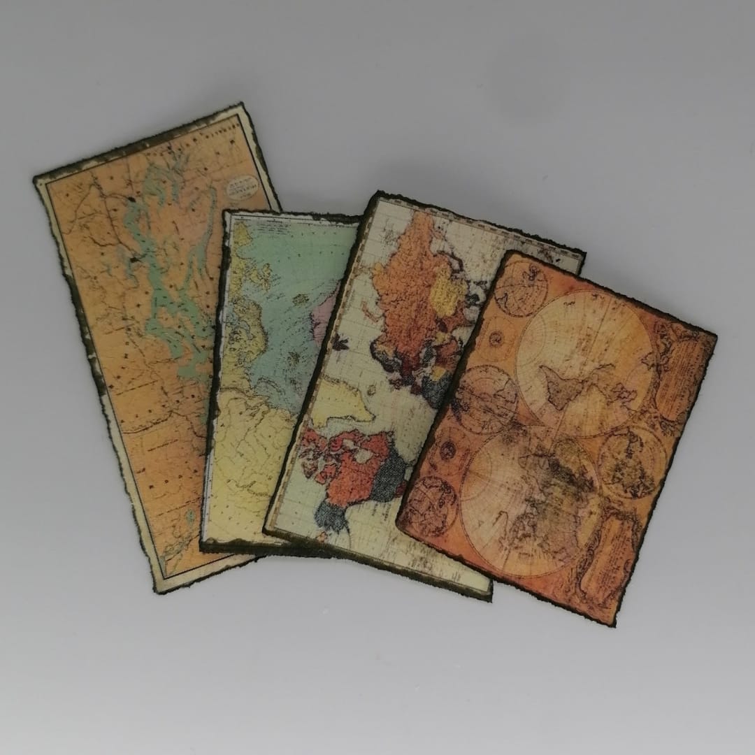 Miniature world maps and scrolls