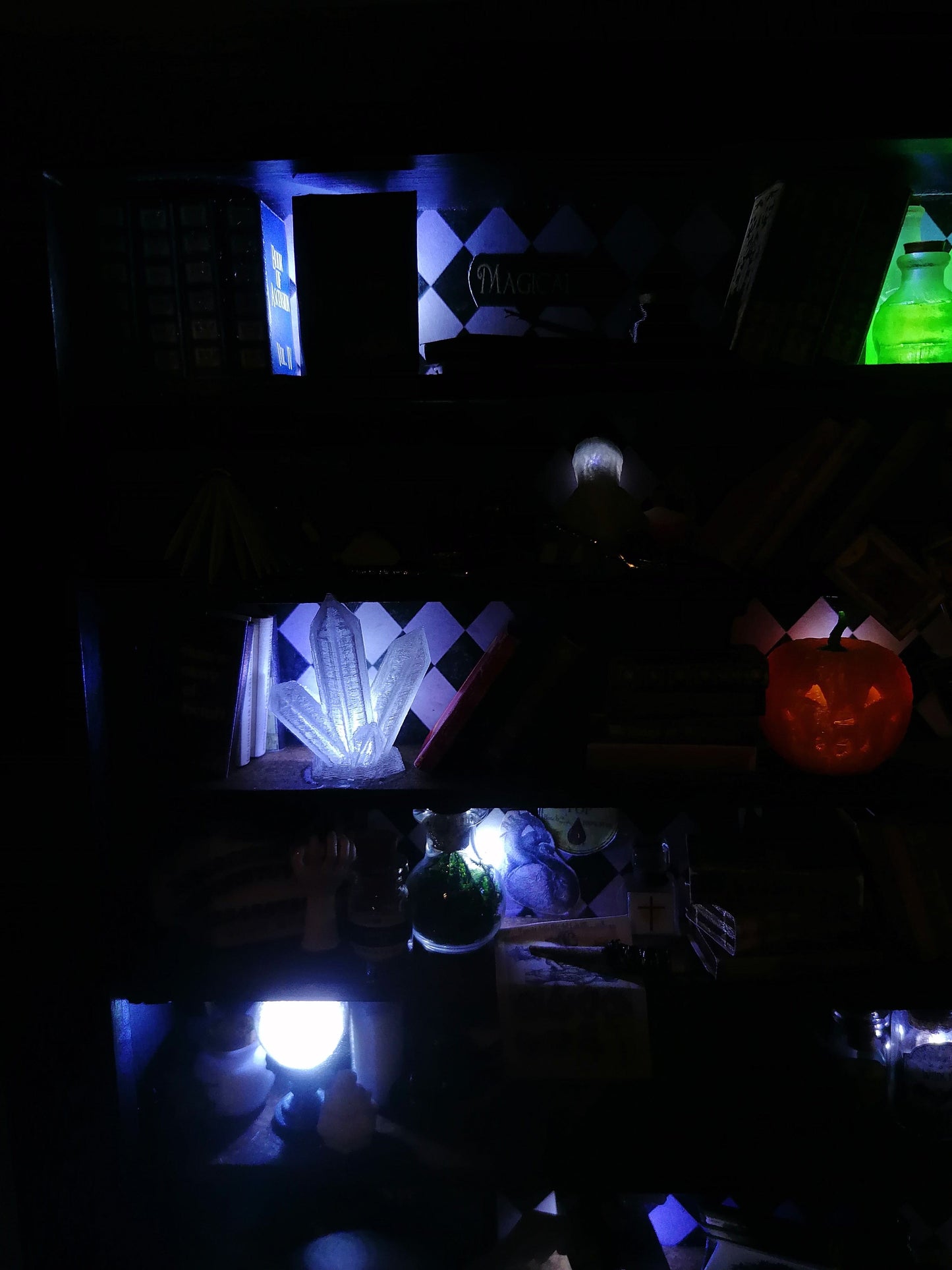 a group of people sitting in a dark room 