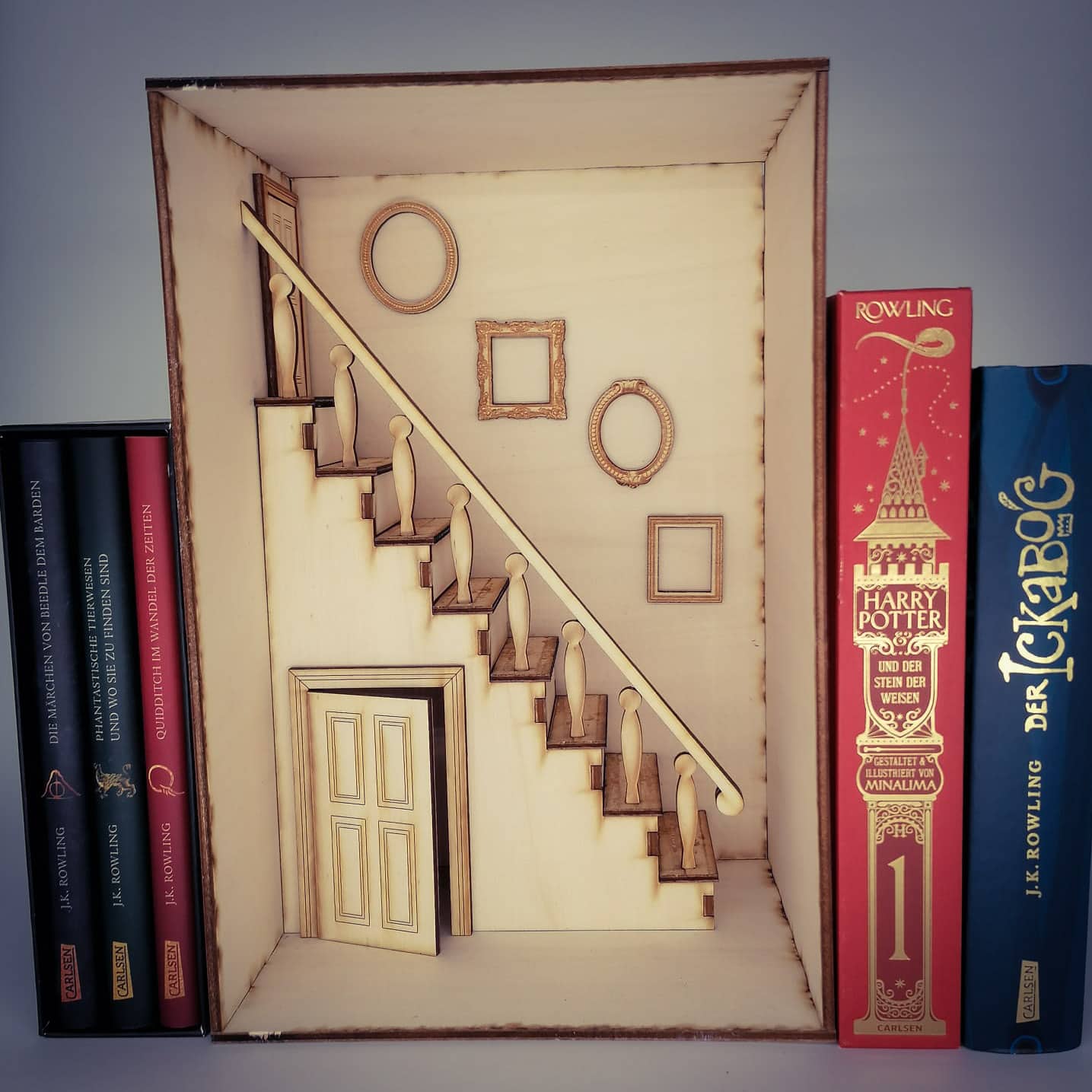 a group of books sitting on top of a shelf 