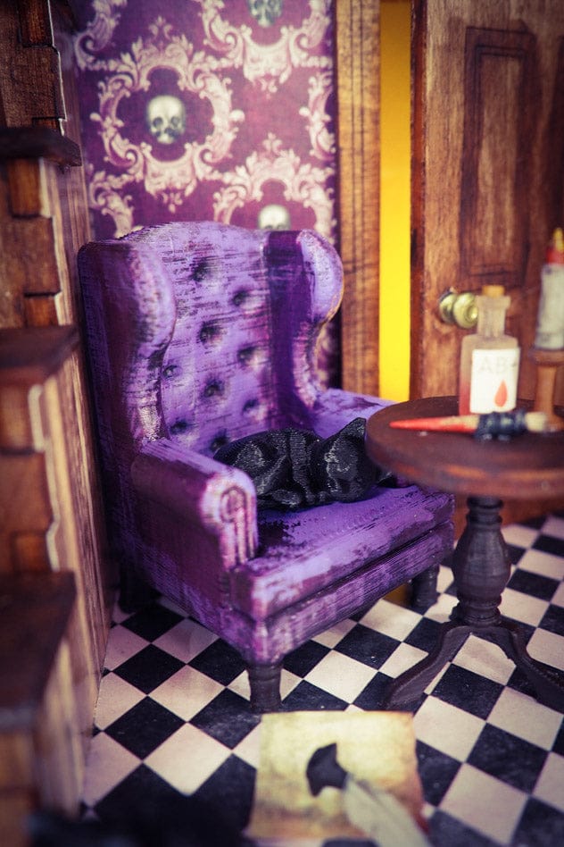 a living room filled with furniture and purple walls 